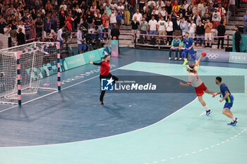 2024-08-09 - Mikkel Hansen (Denmark) and Klemen Ferlin (Slovenia), Handball, Men's Semifinal between Slovenia and Denmark during the Olympic Games Paris 2024 on 9 August 2024 at Pierre Mauroy stadium in Villeneuve-d'Ascq near Lille, France - OLYMPIC GAMES PARIS 2024 - 09/08 - OLYMPIC GAMES PARIS 2024 - OLYMPIC GAMES