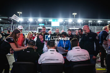 2024-03-01 - ESTRE Kevin (fra), LOTTERER André (ger), VANTHOOR Laurens (bel), Porsche Penske Motorsport, Porsche 963 #06, Hypercar, autograph session, pitwall during the Qatar Airways Qatar 1812 KM, 1st round of the 2024 FIA World Endurance Championship, from February 29 to March 02, 2024 on the Losail International Circuit in Lusail, Qatar - FIA WEC - QATAR AIRWAYS QATAR 1812 KM - ENDURANCE - MOTORS