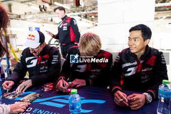 2024-03-01 - HIRAKAWA Ryo (jpn), Toyota Gazoo Racing, Toyota GR010 - Hybrid, portrait, HARTLEY Brendon (nzl), Toyota Gazoo Racing, Toyota GR010 - Hybrid, portrait, BUEMI Sébastien (swi), Toyota Gazoo Racing, Toyota GR010 - Hybrid, portrait, autograph session during the Qatar Airways Qatar 1812 KM, 1st round of the 2024 FIA World Endurance Championship, from February 29 to March 02, 2024 on the Losail International Circuit in Lusail, Qatar - FIA WEC - QATAR AIRWAYS QATAR 1812 KM - ENDURANCE - MOTORS