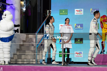 2024-03-02 - 99 TINCKNELL Harry (gbr), JANI Neel (swi), ANDLAUER Julien (fra), Proton Competition, Porsche 963 #99, Hypercar, podium during the Qatar Airways Qatar 1812 KM, 1st round of the 2024 FIA World Endurance Championship, from February 29 to March 02, 2024 on the Losail International Circuit in Lusail, Qatar - FIA WEC - QATAR AIRWAYS QATAR 1812 KM - ENDURANCE - MOTORS