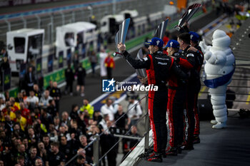 2024-03-02 - ESTRE Kevin (fra), LOTTERER André (ger), VANTHOOR Laurens (bel), Porsche Penske Motorsport, Porsche 963 #06, Hypercar, podium, portrait during the Qatar Airways Qatar 1812 KM, 1st round of the 2024 FIA World Endurance Championship, from February 29 to March 02, 2024 on the Losail International Circuit in Lusail, Qatar - FIA WEC - QATAR AIRWAYS QATAR 1812 KM - ENDURANCE - MOTORS