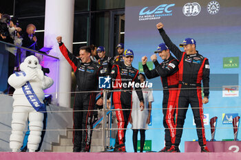 2024-03-02 - podium, portrait, 06 ESTRE Kevin (fra), LOTTERER André (ger), VANTHOOR Laurens (bel), Porsche Penske Motorsport, Porsche 963 #06, Hypercar, during the Qatar Airways Qatar 1812 KM, 1st round of the 2024 FIA World Endurance Championship, from February 29 to March 02, 2024 on the Losail International Circuit in Lusail, Qatar - FIA WEC - QATAR AIRWAYS QATAR 1812 KM - ENDURANCE - MOTORS