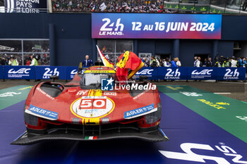 2024-06-16 - 50 FUOCO Antonio (ita), MOLINA Miguel (spa), NIELSEN Nicklas (dnk), Ferrari AF Corse, Ferrari 499P #50, Hypercar, FIA WEC, celebrating their win during the podium of the 2024 24 Hours of Le Mans, 4th round of the 2024 FIA World Endurance Championship, on the Circuit des 24 Heures du Mans, from June 15 to 16, 2024 in Le Mans, France - 24 HEURES DU MANS 2024 - PODIUM - ENDURANCE - MOTORS