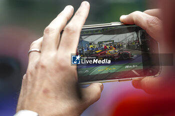 2024-06-16 - 51 PIER GUIDI Alessandro (ita), CALADO James (gbr), GIOVINAZZI Antonio (ita), Ferrari AF Corse, Ferrari 499P #51, Hypercar, FIA WEC, illustration post race on parc ferme during the podium of the 2024 24 Hours of Le Mans, 4th round of the 2024 FIA World Endurance Championship, on the Circuit des 24 Heures du Mans, from June 15 to 16, 2024 in Le Mans, France - 24 HEURES DU MANS 2024 - PODIUM - ENDURANCE - MOTORS