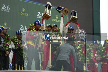 2024-06-16 - FUOCO Antonio (ita), MOLINA Miguel (spa), NIELSEN Nicklas (dnk), Ferrari AF Corse, Ferrari 499P #50, Hypercar, FIA WEC, celebrate with the trophy on podium during of the 2024 24 Hours of Le Mans, 4th round of the 2024 FIA World Endurance Championship, on the Circuit des 24 Heures du Mans, from June 15 to 16, 2024 in Le Mans, France - 24 HEURES DU MANS 2024 - PODIUM - ENDURANCE - MOTORS