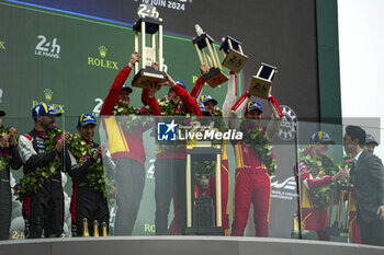 2024-06-16 - FUOCO Antonio (ita), MOLINA Miguel (spa), NIELSEN Nicklas (dnk), Ferrari AF Corse, Ferrari 499P #50, Hypercar, FIA WEC, celebrate with the trophy on podium during of the 2024 24 Hours of Le Mans, 4th round of the 2024 FIA World Endurance Championship, on the Circuit des 24 Heures du Mans, from June 15 to 16, 2024 in Le Mans, France - 24 HEURES DU MANS 2024 - PODIUM - ENDURANCE - MOTORS