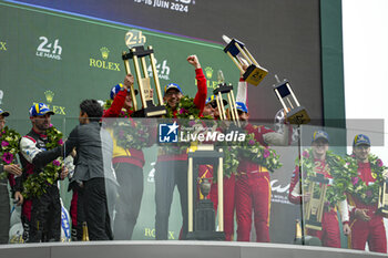 2024-06-16 - FUOCO Antonio (ita), MOLINA Miguel (spa), NIELSEN Nicklas (dnk), Ferrari AF Corse, Ferrari 499P #50, Hypercar, FIA WEC, celebrate with the trophy on podium during of the 2024 24 Hours of Le Mans, 4th round of the 2024 FIA World Endurance Championship, on the Circuit des 24 Heures du Mans, from June 15 to 16, 2024 in Le Mans, France - 24 HEURES DU MANS 2024 - PODIUM - ENDURANCE - MOTORS