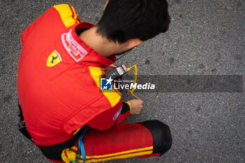 2024-07-13 - Mechanic Ferrari AF Corse during the 2024 Rolex 6 Hours of Sao Paulo, 5th round of the 2024 FIA World Endurance Championship, from July 11 to 14, 2024 on the Autódromo José Carlos Pace in Interlagos, Brazil - FIA WEC - 6 HOURS OF SAO PAULO 2024 - ENDURANCE - MOTORS