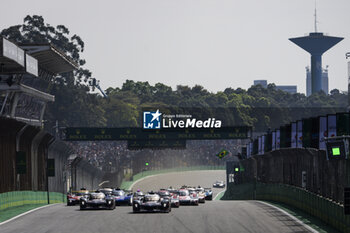 2024-07-14 - Start of the race, 07 CONWAY Mike (gbr), KOBAYASHI Kamui (jpn), DE VRIES Nyck (nld), Toyota Gazoo Racing, Toyota GR010 - Hybrid #07, Hypercar, 08 BUEMI Sébastien (swi), HARTLEY Brendon (nzl), HIRAKAWA Ryo (jpn), Toyota Gazoo Racing, Toyota GR010 - Hybrid #08, Hypercar, action during the 2024 Rolex 6 Hours of Sao Paulo, 5th round of the 2024 FIA World Endurance Championship, from July 12 to 14, 2024 on the Autódromo José Carlos Pace in Interlagos, Brazil - FIA WEC - 6 HOURS OF SAO PAULO 2024 - ENDURANCE - MOTORS