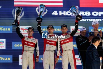 2024-10-19 - 14 EDGAR Jonny (gbr), DELETRAZ Louis (swi), KUBICA Robert (pol), AO by TF, Oreca 07 - Gibson, action at the podium, portrait during the 4 Hours of Portimao 2024, 6th round of the 2024 European Le Mans Series on the Algarve International Circuit from October 16 to 19, 2024 in Portimao, Portugal - AUTO - ELMS - 4 HOURS OF PORTIMAO 2024 - ENDURANCE - MOTORS