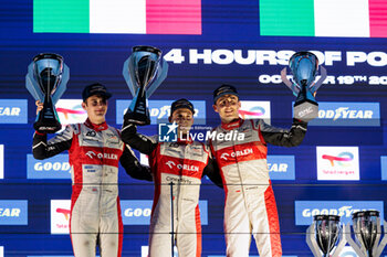 2024-10-19 - 14 EDGAR Jonny (gbr), DELETRAZ Louis (swi), KUBICA Robert (pol), AO by TF, Oreca 07 - Gibson, action at the podium, portrait during the 4 Hours of Portimao 2024, 6th round of the 2024 European Le Mans Series on the Algarve International Circuit from October 16 to 19, 2024 in Portimao, Portugal - AUTO - ELMS - 4 HOURS OF PORTIMAO 2024 - ENDURANCE - MOTORS