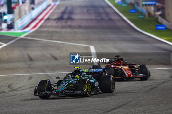 2024-02-23 - 14 ALONSO Fernando (spa), Aston Martin F1 Team AMR24 and 16 LECLERC Charles (mco), Scuderia Ferrari SF-24, action during the Formula 1 Aramco pre-season testing 2024 of the 2024 FIA Formula One World Championship from February 21 to 23, 2024 on the Bahrain International Circuit, in Sakhir, Bahrain - F1 - PRE-SEASON TESTING 2024 - BAHRAIN - FORMULA 1 - MOTORS