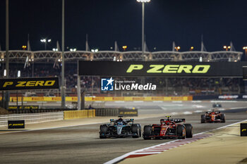 2024-03-02 - 55 SAINZ Carlos (spa), Scuderia Ferrari SF-24, 63 RUSSELL George (gbr), Mercedes AMG F1 Team W15, action during the Formula 1 Gulf Air Bahrain Grand Prix 2024, 1st round of the 2024 FIA Formula One World Championship from February 29 to March 2, 2024 on the Bahrain International Circuit, in Sakhir, Bahrain - F1 - BAHRAIN GRAND PRIX 2024 - FORMULA 1 - MOTORS