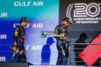 2024-03-02 - podium PEREZ Sergio (mex), Red Bull Racing RB20, VERSTAPPEN Max (ned), Red Bull Racing RB20, portrait during the Formula 1 Gulf Air Bahrain Grand Prix 2024, 1st round of the 2024 FIA Formula One World Championship from February 29 to March 2, 2024 on the Bahrain International Circuit, in Sakhir, Bahrain - F1 - BAHRAIN GRAND PRIX 2024 - FORMULA 1 - MOTORS