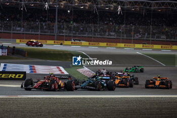 2024-03-02 - 55 SAINZ Carlos (spa), Scuderia Ferrari SF-24, action 14 ALONSO Fernando (spa), Aston Martin F1 Team AMR24, action start of the race, depart, during the Formula 1 Gulf Air Bahrain Grand Prix 2024, 1st round of the 2024 FIA Formula One World Championship from February 29 to March 2, 2024 on the Bahrain International Circuit, in Sakhir, Bahrain - F1 - BAHRAIN GRAND PRIX 2024 - FORMULA 1 - MOTORS