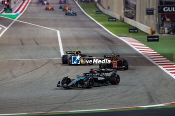 2024-03-02 - 63 RUSSELL George (gbr), Mercedes AMG F1 Team W15, 55 SAINZ Carlos (spa), Scuderia Ferrari SF-24, 11 PEREZ Sergio (mex), Red Bull Racing RB20, action during the Formula 1 Gulf Air Bahrain Grand Prix 2024, 1st round of the 2024 FIA Formula One World Championship from February 29 to March 2, 2024 on the Bahrain International Circuit, in Sakhir, Bahrain - F1 - BAHRAIN GRAND PRIX 2024 - FORMULA 1 - MOTORS