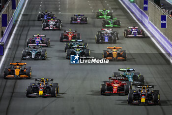 2024-03-09 - 01 VERSTAPPEN Max (nld), Red Bull Racing RB20, 11 PEREZ Sergio (mex), Red Bull Racing RB20 and 16 LECLERC Charles (mco), Scuderia Ferrari SF-24, action, start of the race, depart, during the Formula 1 STC Saudi Arabian Grand Prix 2024, 2nd round of the 2024 Formula One World Championship from March 7 to 9, 2024 on the Jeddah Corniche Circuit, in Jeddah, Saudi Arabia - F1 - SAUDI ARABIAN GRAND PRIX 2024 - FORMULA 1 - MOTORS