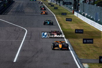 2024-04-07 - 04 NORRIS Lando (gbr), McLaren F1 Team MCL38, 55 SAINZ Carlos (spa), Scuderia Ferrari SF-24, action during the Formula 1 MSC Cruises Japanese Grand Prix 2024, 4th round of the 2024 Formula One World Championship from April 5 to 7, 2024 on the Suzuka International Racing Course, in Suzuka, Japan - F1 - JAPANESE GRAND PRIX 2024 - FORMULA 1 - MOTORS