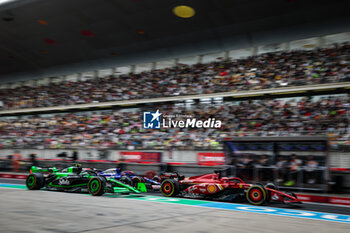 2024-04-19 - 24 ZHOU Guanyu (chi), Stake F1 Team Kick Sauber C44, 16 LECLERC Charles (mco), Scuderia Ferrari SF-24, action during the Formula 1 Lenovo Chinese Grand Prix 2024, 5th round of the 2024 Formula One World Championship from April 19 to 21, 2024 on the Shanghai International Circuit, in Shanghai, China - F1 - CHINESE GRAND PRIX 2024 - FORMULA 1 - MOTORS