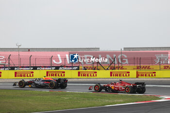 2024-04-20 - 11 PEREZ Sergio (mex), Red Bull Racing RB20, action and 16 LECLERC Charles (mco), Scuderia Ferrari SF-24, action during the Formula 1 Lenovo Chinese Grand Prix 2024, 5th round of the 2024 Formula One World Championship from April 19 to 21, 2024 on the Shanghai International Circuit, in Shanghai, China - F1 - CHINESE GRAND PRIX 2024 - FORMULA 1 - MOTORS