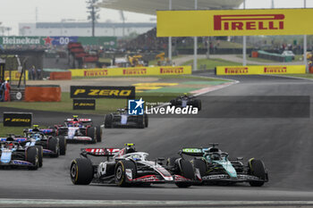 2024-04-20 - 27 HULKENBERG Nico (ger), Haas F1 Team VF-24 Ferrari, action and 18 STROLL Lance (can), Aston Martin F1 Team AMR24, action during the Formula 1 Lenovo Chinese Grand Prix 2024, 5th round of the 2024 Formula One World Championship from April 19 to 21, 2024 on the Shanghai International Circuit, in Shanghai, China - F1 - CHINESE GRAND PRIX 2024 - FORMULA 1 - MOTORS