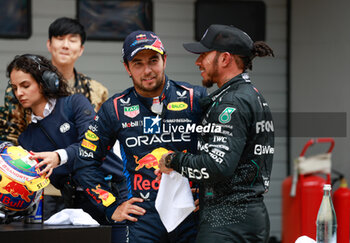 2024-04-20 - PEREZ Sergio (mex), Red Bull Racing RB20, portrait and HAMILTON Lewis (gbr), Mercedes AMG F1 Team W15, portrait during the Formula 1 Lenovo Chinese Grand Prix 2024, 5th round of the 2024 Formula One World Championship from April 19 to 21, 2024 on the Shanghai International Circuit, in Shanghai, China - F1 - CHINESE GRAND PRIX 2024 - FORMULA 1 - MOTORS