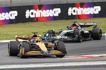 2024-04-21 - 81 PIASTRI Oscar (aus), McLaren F1 Team MCL38, action and 63 RUSSELL George (gbr), Mercedes AMG F1 Team W15, action during the Formula 1 Lenovo Chinese Grand Prix 2024, 5th round of the 2024 Formula One World Championship from April 19 to 21, 2024 on the Shanghai International Circuit, in Shanghai, China - F1 - CHINESE GRAND PRIX 2024 - FORMULA 1 - MOTORS