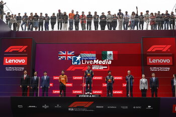2024-04-21 - VERSTAPPEN Max (ned), Red Bull Racing RB20, portrait, NORRIS Lando (gbr), McLaren F1 Team MCL38, portrait and PEREZ Sergio (mex), Red Bull Racing RB20, portrait in the podium during the Formula 1 Lenovo Chinese Grand Prix 2024, 5th round of the 2024 Formula One World Championship from April 19 to 21, 2024 on the Shanghai International Circuit, in Shanghai, China - F1 - CHINESE GRAND PRIX 2024 - FORMULA 1 - MOTORS
