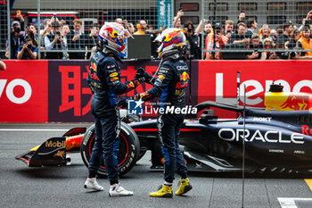 21/04/2024 - VERSTAPPEN Max (ned), Red Bull Racing RB20, portrait celebrating victory with PEREZ Sergio (mex), Red Bull Racing RB20, during the Formula 1 Lenovo Chinese Grand Prix 2024, 5th round of the 2024 Formula One World Championship from April 19 to 21, 2024 on the Shanghai International Circuit, in Shanghai, China - F1 - CHINESE GRAND PRIX 2024 - FORMULA 1 - MOTORI