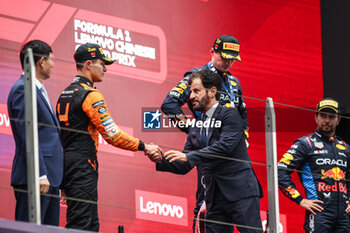 21/04/2024 - BEN SULAYEM Mohammed (uae), President of the FIA, portrait NORRIS Lando (gbr), McLaren F1 Team MCL38, portrait podium during the Formula 1 Lenovo Chinese Grand Prix 2024, 5th round of the 2024 Formula One World Championship from April 19 to 21, 2024 on the Shanghai International Circuit, in Shanghai, China - F1 - CHINESE GRAND PRIX 2024 - FORMULA 1 - MOTORI