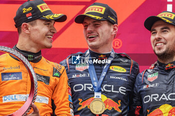 2024-04-21 - NORRIS Lando (gbr), McLaren F1 Team MCL38, portrait, VERSTAPPEN Max (ned), Red Bull Racing RB20, portrait, PEREZ Sergio (mex), Red Bull Racing RB20, portraitN podium during the Formula 1 Lenovo Chinese Grand Prix 2024, 5th round of the 2024 Formula One World Championship from April 19 to 21, 2024 on the Shanghai International Circuit, in Shanghai, China - F1 - CHINESE GRAND PRIX 2024 - FORMULA 1 - MOTORS