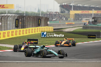 2024-04-21 - 14 ALONSO Fernando (spa), Aston Martin F1 Team AMR24, action 11 PEREZ Sergio (mex), Red Bull Racing RB20, action during the Formula 1 Lenovo Chinese Grand Prix 2024, 5th round of the 2024 Formula One World Championship from April 19 to 21, 2024 on the Shanghai International Circuit, in Shanghai, China - F1 - CHINESE GRAND PRIX 2024 - FORMULA 1 - MOTORS