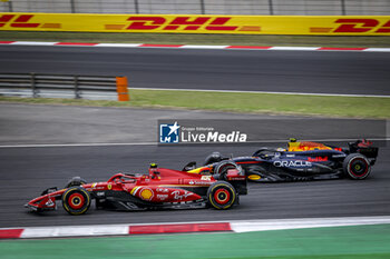 21/04/2024 - 55 SAINZ Carlos (spa), Scuderia Ferrari SF-24, action, 11 PEREZ Sergio (mex), Red Bull Racing RB20, action during the Formula 1 Lenovo Chinese Grand Prix 2024, 5th round of the 2024 Formula One World Championship from April 19 to 21, 2024 on the Shanghai International Circuit, in Shanghai, China - F1 - CHINESE GRAND PRIX 2024 - FORMULA 1 - MOTORI