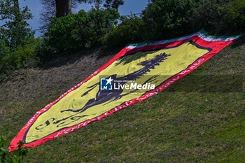 2024-05-17 - Flag of Ferrari supporter on green lawn - FORMULA 1 MSC CRUISES GRAN PREMIO DELL'EMILIA-ROMAGNA 2024 - FREE PRACTICE 1 - FORMULA 1 - MOTORS