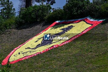 2024-05-17 - Flag of Ferrari supporter on green lawn - FORMULA 1 MSC CRUISES GRAN PREMIO DELL'EMILIA-ROMAGNA 2024 - FREE PRACTICE 1 - FORMULA 1 - MOTORS