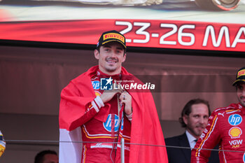 2024-05-26 - Charles Leclerc (MON) - Scuderia Ferrari - Ferrari SF-24 - Ferrari with Monaco flag on the podium

Race and celebrations of Formula 1 Grand Prix de Monaco 2024 at Monte Carlo (MC), may 23-26 2024 - FORMULA 1 GRAND PRIX DE MONACO - RACE - FORMULA 1 - MOTORS