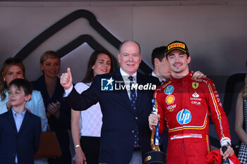 2024-05-26 - her majesty Prince Albert II of Monaco an Charles Leclerc (MON) - Scuderia Ferrari - Ferrari SF-24 - Ferrari on the podium 

during Formula 1 Grand Prix de Monaco 2024 at Monte Carlo (MC), may 23-26 2024 - FORMULA 1 GRAND PRIX DE MONACO - RACE - FORMULA 1 - MOTORS