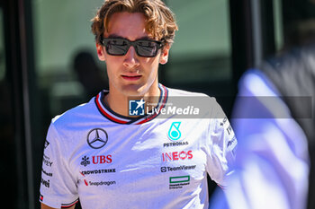 2024-05-18 - George Russell Mercedes Grand Prix Ltd Mercedes-AMG PETRONAS Formula One Team portrait enters the paddock of Autodromo Internazionale Enzo e Dino Ferrari - FORMULA 1 MSC CRUISES GRAN PREMIO DELL'EMILIA-ROMAGNA 2024 - PADDOCK AND DRIVERS - FORMULA 1 - MOTORS