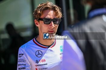 2024-05-18 - George Russell Mercedes Grand Prix Ltd Mercedes-AMG PETRONAS Formula One Team portrait enters the paddock of Autodromo Internazionale Enzo e Dino Ferrari - FORMULA 1 MSC CRUISES GRAN PREMIO DELL'EMILIA-ROMAGNA 2024 - PADDOCK AND DRIVERS - FORMULA 1 - MOTORS