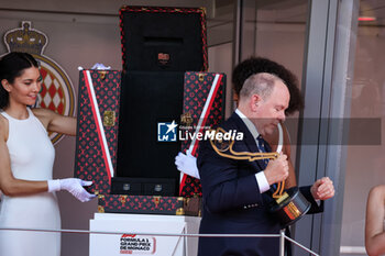 2024-05-26 - The podium ceremony: Prince Albert II is the Sovereign of the Principality of Monaco and the head of the Princely House of Grimaldi, during the Formula 1 Grand Prix de Monaco 2024, 8th round of the 2024 Formula One World Championship from May 23 to 26, 2024 on the Circuit de Monaco, in Monaco - F1 - MONACO GRAND PRIX 2024 - FORMULA 1 - MOTORS