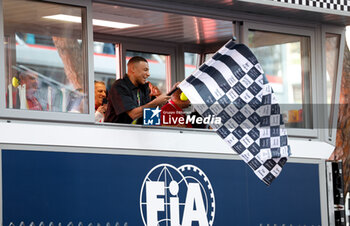 2024-05-26 - Kylian Mbappe of France with the checkered flag, drapeau during the Formula 1 Grand Prix de Monaco 2024, 8th round of the 2024 Formula One World Championship from May 23 to 26, 2024 on the Circuit de Monaco, in Monaco - F1 - MONACO GRAND PRIX 2024 - FORMULA 1 - MOTORS