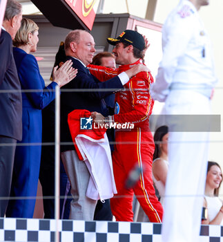 2024-05-26 - LECLERC Charles (mco), Scuderia Ferrari SF-24 and Albert II Grimaldi Prince of Monaco on podium, portrait, during the Formula 1 Grand Prix de Monaco 2024, 8th round of the 2024 Formula One World Championship from May 23 to 26, 2024 on the Circuit de Monaco, in Monaco - F1 - MONACO GRAND PRIX 2024 - FORMULA 1 - MOTORS