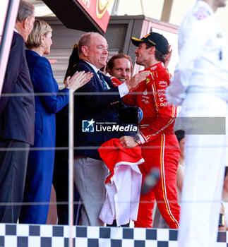 2024-05-26 - LECLERC Charles (mco), Scuderia Ferrari SF-24 and Albert II Grimaldi Prince of Monaco on podium, portrait, during the Formula 1 Grand Prix de Monaco 2024, 8th round of the 2024 Formula One World Championship from May 23 to 26, 2024 on the Circuit de Monaco, in Monaco - F1 - MONACO GRAND PRIX 2024 - FORMULA 1 - MOTORS