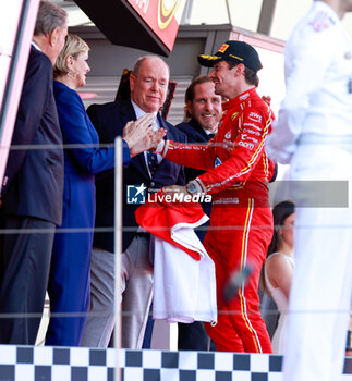 2024-05-26 - LECLERC Charles (mco), Scuderia Ferrari SF-24 and Albert II Grimaldi Prince of Monaco on podium, portrait, during the Formula 1 Grand Prix de Monaco 2024, 8th round of the 2024 Formula One World Championship from May 23 to 26, 2024 on the Circuit de Monaco, in Monaco - F1 - MONACO GRAND PRIX 2024 - FORMULA 1 - MOTORS