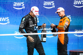 2024-06-09 - NORRIS Lando (gbr), McLaren F1 Team MCL38, portrait RUSSELL George (gbr), Mercedes AMG F1 Team W15, portrait podium during the Formula 1 AWS Grand Prix du Canada 2024, 9th round of the 2024 Formula One World Championship from June 07 to 09, 2024 on the Circuit Gilles Villeneuve, in Montréal, Canada - F1 - CANADIAN GRAND PRIX 2024 - FORMULA 1 - MOTORS