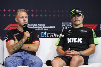 2024-06-20 - MAGNUSSEN Kevin (den), Haas F1 Team VF-24 Ferrari, portrait and BOTTAS Valtteri (fin), Stake F1 Team Kick Sauber C44, portrait during the Formula 1 Aramco Gran Premio de Espana 2024, 10th round of the 2024 Formula One World Championship from June 21 to 23, 2024 on the Circuit de Barcelona-Catalunya, in Montmeló, Spain - F1 - SPANISH GRAND PRIX 2024 - FORMULA 1 - MOTORS