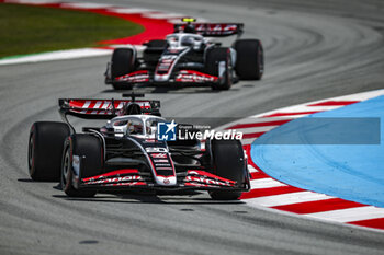 2024-06-22 - 20 MAGNUSSEN Kevin (den), Haas F1 Team VF-24 Ferrari and 27 HULKENBERG Nico (ger), Haas F1 Team VF-24 Ferrari, action during the Formula 1 Aramco Gran Premio de Espana 2024, 10th round of the 2024 Formula One World Championship from June 21 to 23, 2024 on the Circuit de Barcelona-Catalunya, in Montmeló, Spain - F1 - SPANISH GRAND PRIX 2024 - FORMULA 1 - MOTORS