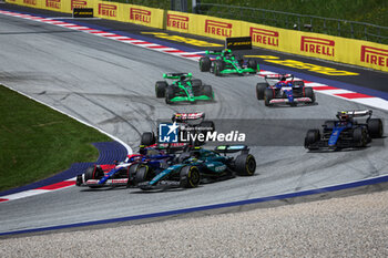 2024-06-29 - 14 ALONSO Fernando (spa), Aston Martin F1 Team AMR24, 22 TSUNODA Yuki (jap), Visa Cash App RB F1 Team VCARB 01, action during the Formula 1 Qatar Airways Austrian Grand Prix 2024, 11th round of the 2024 Formula One World Championship from June 28 to 30, 2024 on the Red Bull Ring, in Spielberg, Austria - F1 - AUSTRIAN GRAND PRIX 2024 - FORMULA 1 - MOTORS