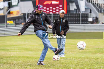 2024-07-05 - Pierre Gasly (FRA) Esteban Ocon (FRA) - Alpine F1 Team - Alpine A524 - Renault Playing football on day 1, thursday july 4, 2024 of the formula 1 qatar airways british grand prix 2024, scheduled to take place at the silverstone circuit from july 5 to july 7, 2024 - FORMULA 1 - QATAR AIRWAYS BRITISHGRAND PRIX 2024 - PRACTICE - FORMULA 1 - MOTORS