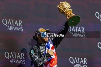 2024-07-07 - Lewis Hamilton (GBR) - Mercedes-AMG PETRONAS F1 Team - Mercedes W15 - Mercedes E Performance on the podium after winning the Race on day 4, Sunday july 7, 2024 of the formula 1 qatar airways british grand prix 2024, scheduled to take place at the silverstone circuit from july 5 to july 7, 2024 - FORMULA 1 - QATAR AIRWAYS BRITISHGRAND PRIX 2024 - RACE - FORMULA 1 - MOTORS